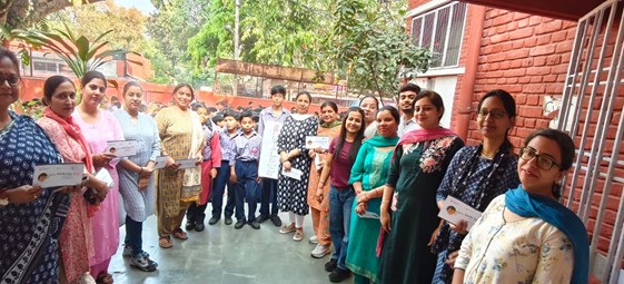 Earth Day pledge card distribution at school